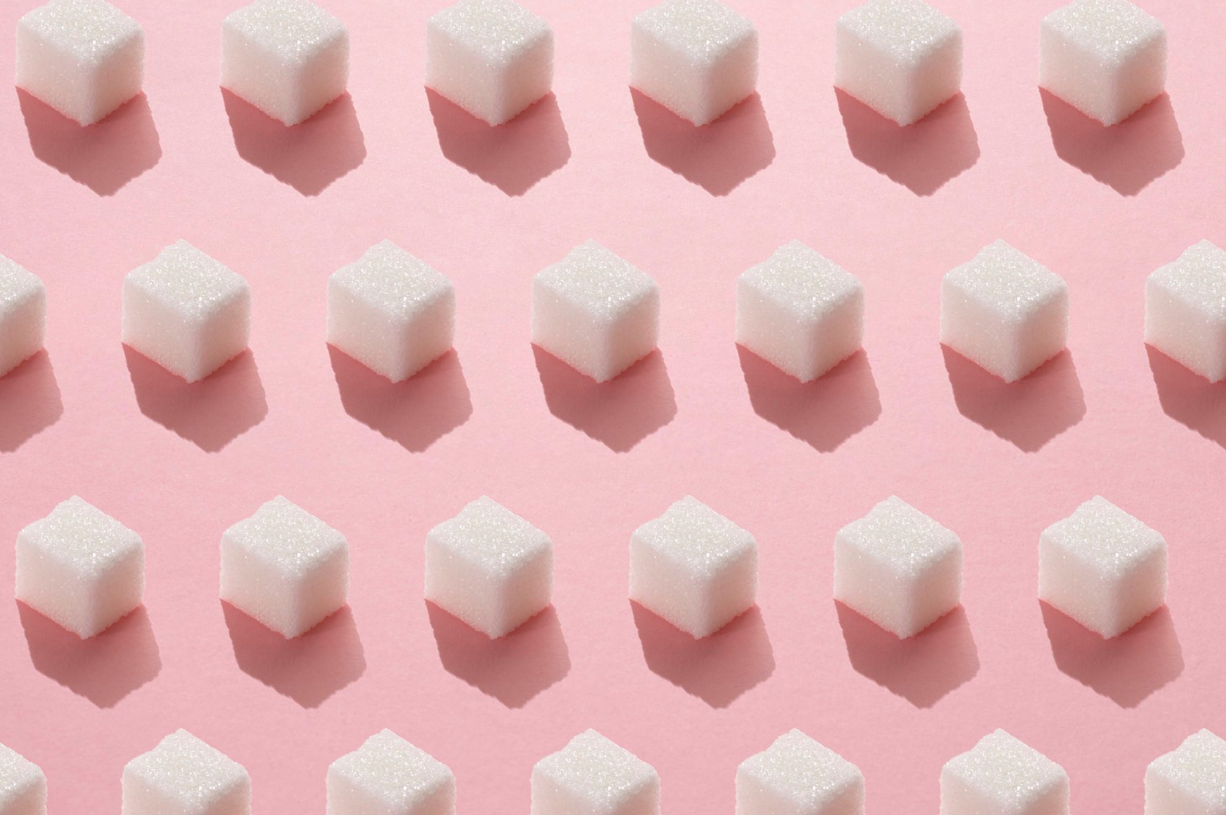 sugar cubes repeated on light pink background