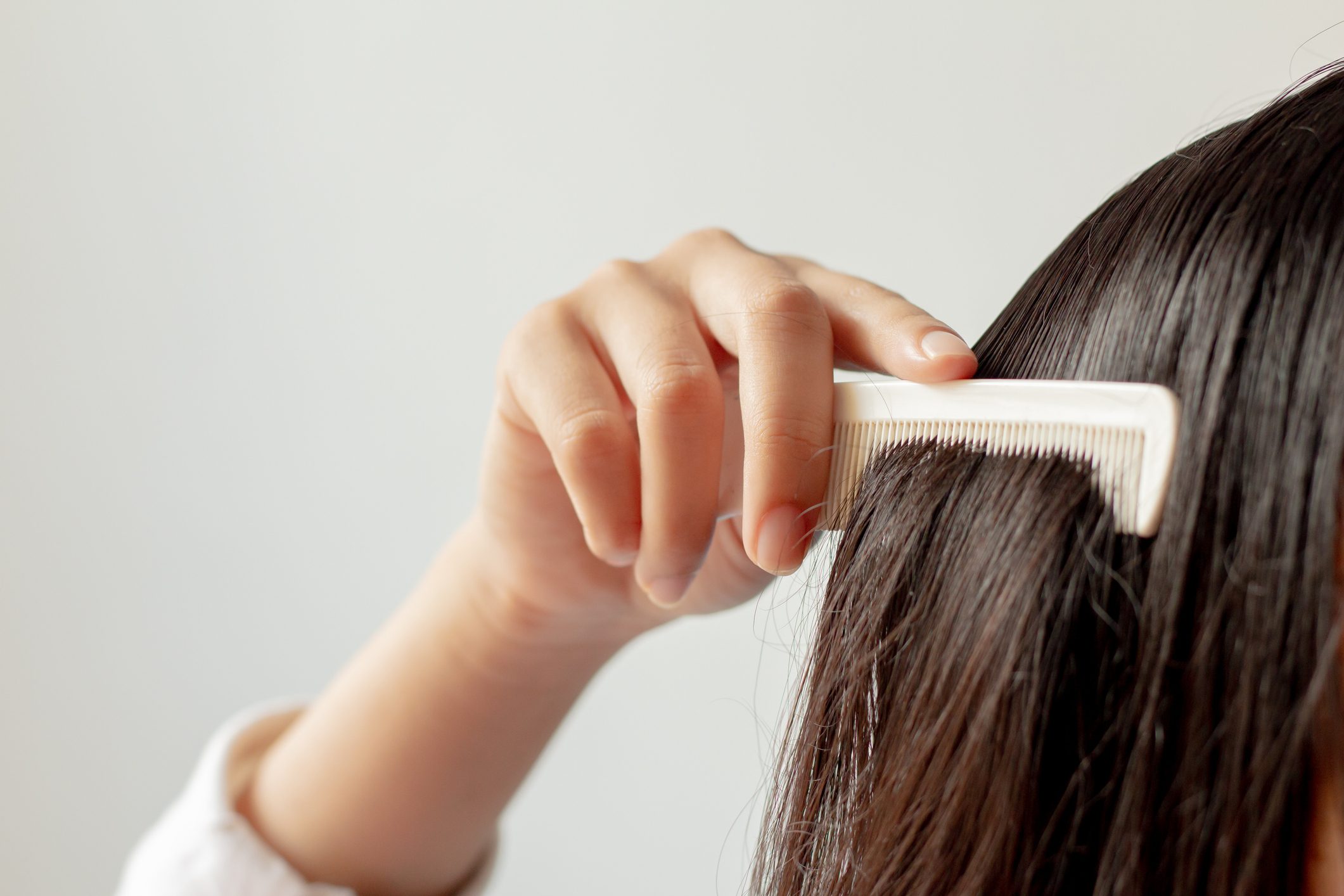 combing through hair close up